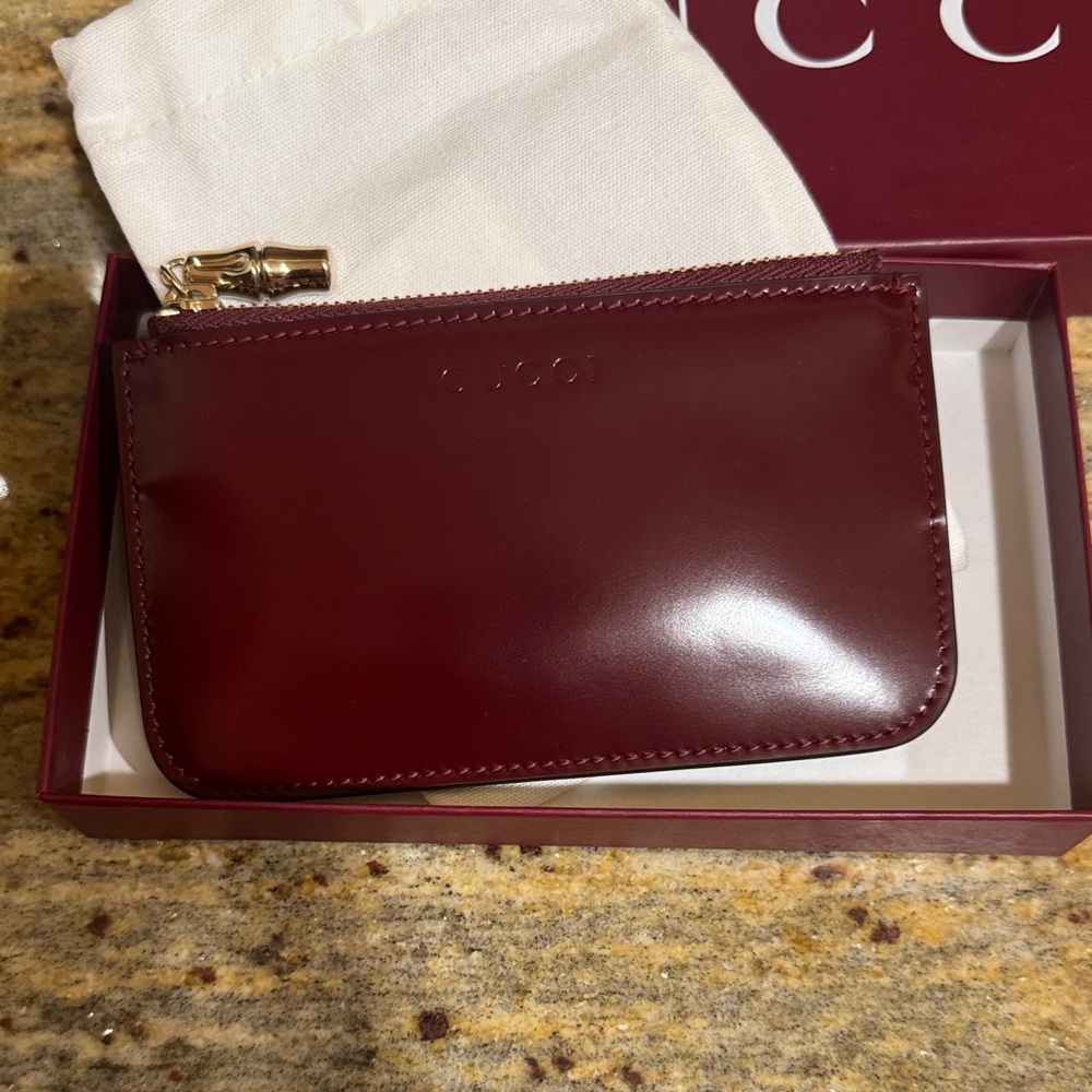 NWT Gucci Deep Red Coin pouch ,, polished Leather with Gold Zip Bamboo charm